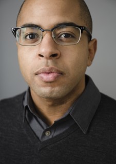 Close up of mixed race man wearing eyeglasses
