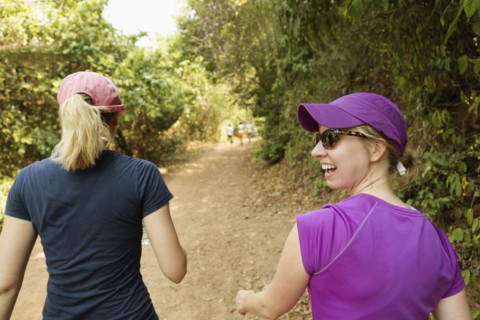 Women walking on remote dirt path