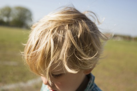 Close up of Caucasian boy in park