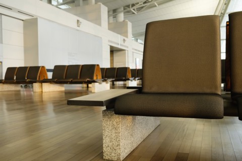 Empty chairs in airport waiting area