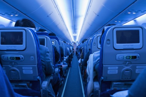 Aisle in full airplane