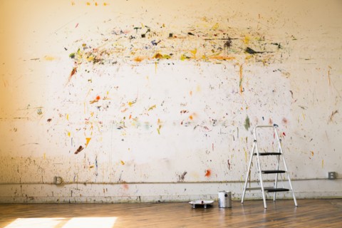 Paint splattered on wall near ladder
