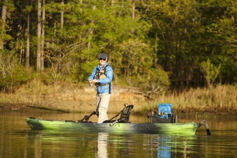 Caucasian man fishing on kayak