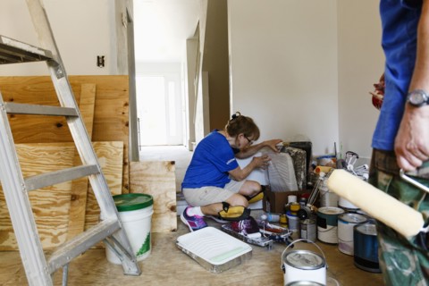 Women preparing to paint walls