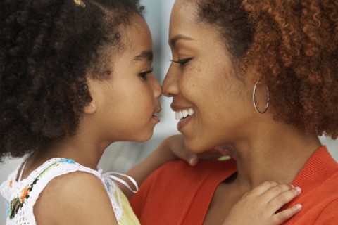 Mother and daughter touching noses