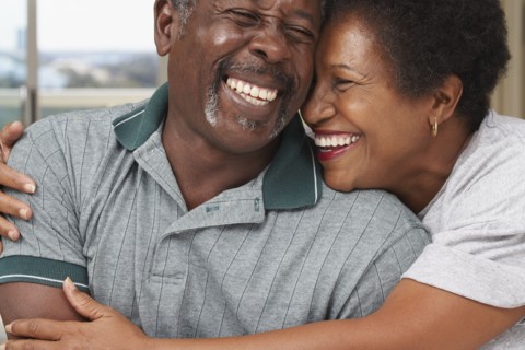 Senior African American couple hugging