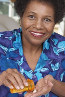 Senior African American woman with medication