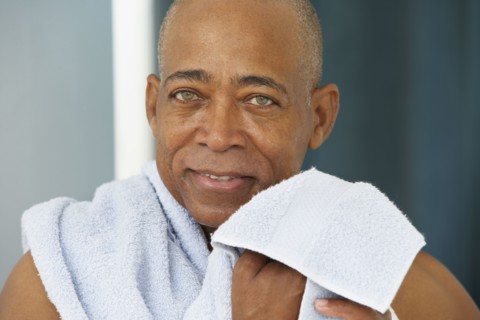 Close up of senior African man with towel