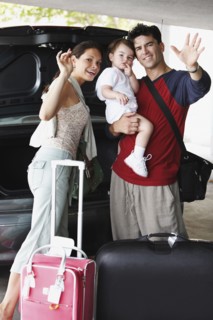 Hispanic family going on trip and waving