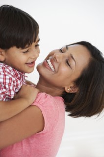 Indian mother and son hugging