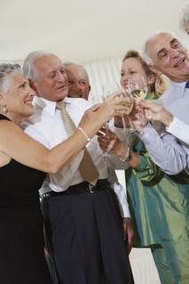 Senior couples toasting at party