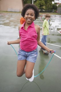 African American girl jumping rope