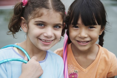 Close up of multi-ethnic girls smiling