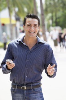 Spanish man holding cell phone