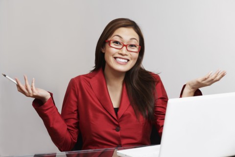 Asian businesswoman shrugging shoulders