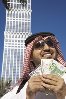 Arab man holding money