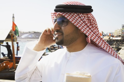 Arab man talking on cell phone