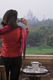 Woman taking photograph of the Taj Mahal