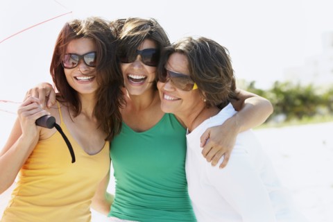 Mother and sisters hugging