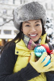 Korean woman carrying Christmas ornaments