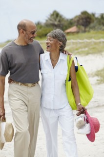 African couple walking on beach