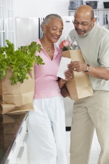 African couple grocery shopping
