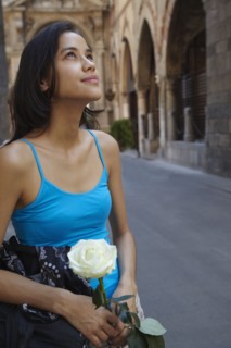 Thai woman holding white rose