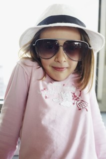 Italian girl in fedora and sunglasses