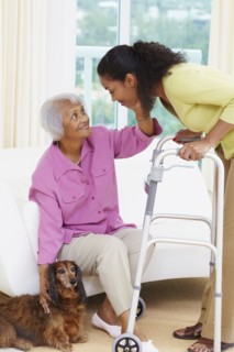 African American woman helping senior mother