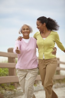 African American woman walking with mother