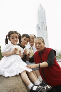 Chinese grandparents enjoying grandchildren
