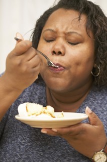 African American enjoying a piece of cake