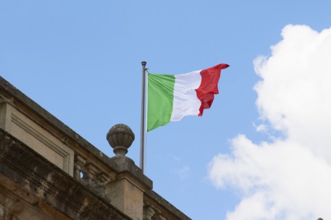 Italian flag fluttering on rooftop