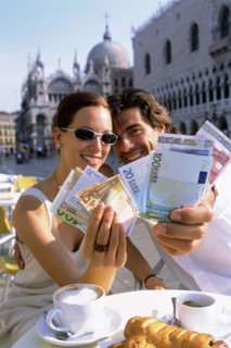 Couple with wads of cash having breakfast at cafe