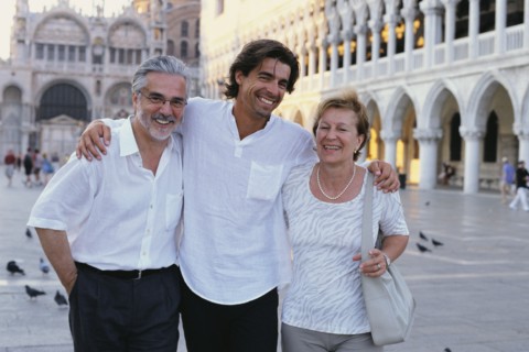 Parents and son walking in St. Mark's Square