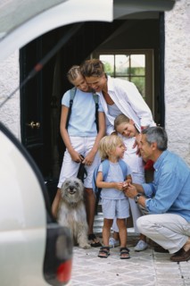 Caucasian family standing in doorway
