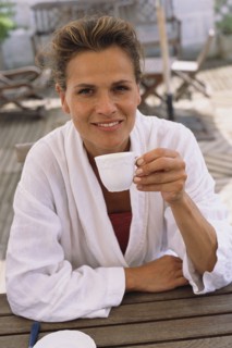 Caucasian woman drinking coffee outdoors