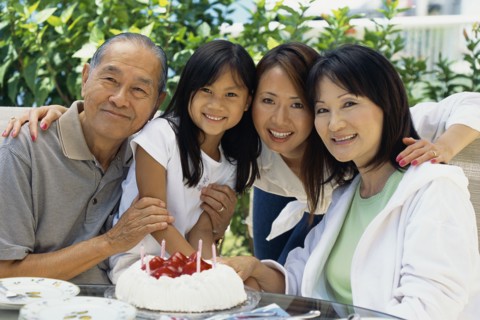 Family smiling together at birthday