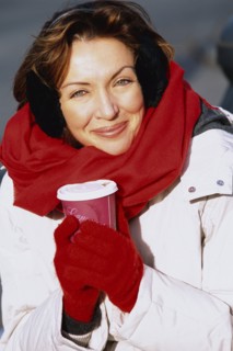 Woman drinking coffee outdoors