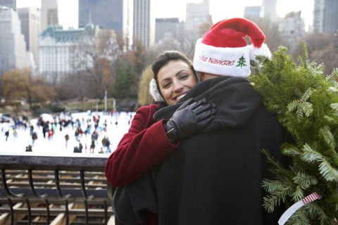 Couple hugging on city street