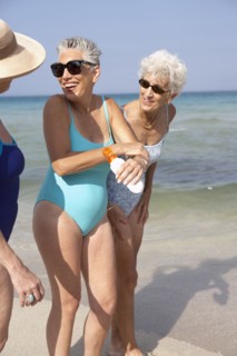 Senior women walking on beach