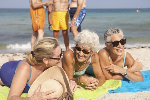 Senior women relaxing on beach