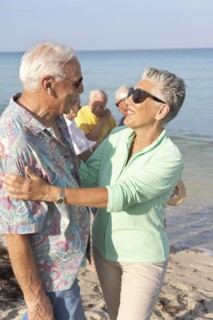 Senior couple hugging on beach
