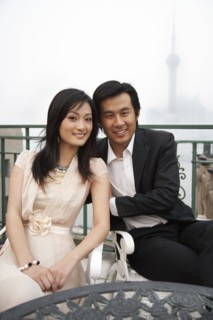 Couple sitting at sidewalk cafe