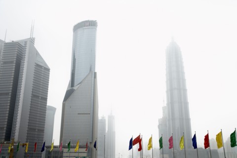 Colorful flags and urban skyscrapers