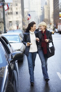 Women walking together on city street