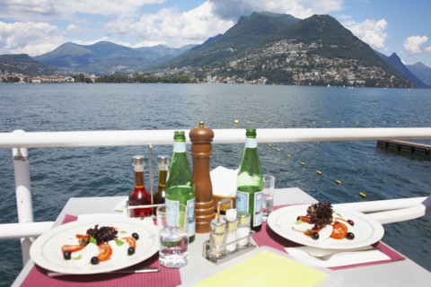 Plates of food at restaurant overlooking rural lake