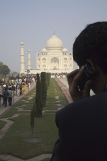 Indian businessman on cell phone by Taj Mahal