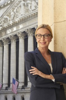 Caucasian businesswoman standing in city