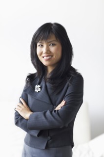 Smiling businesswoman with arms crossed